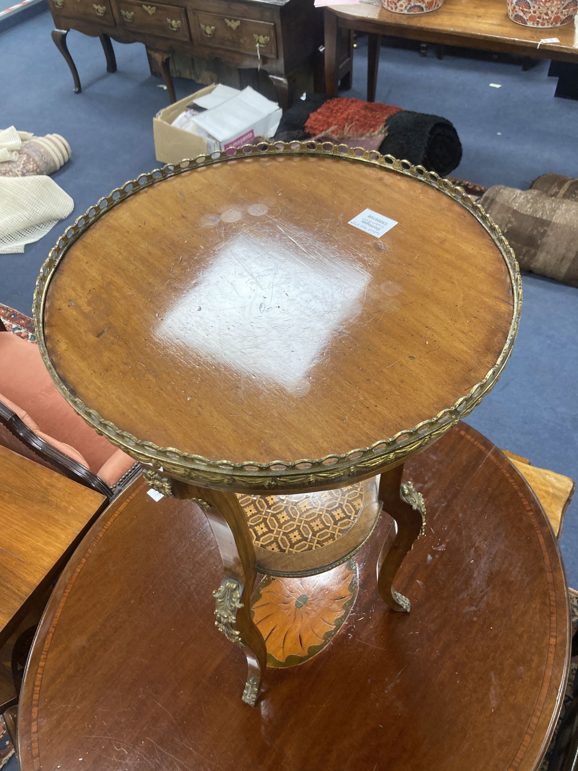 A Louis XVI style inlaid mahogany and ormolu mounted two tier gueridon, diameter 45cm, height 76cm